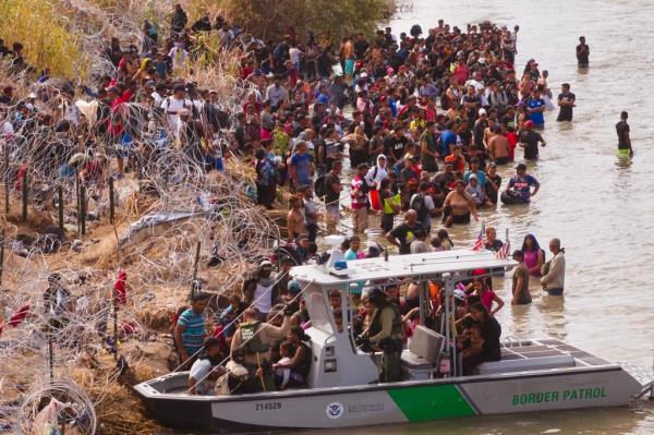 Migrants who crossed the Rio Grande river from Mexico into the United States are transported by U.S. Customs and Border Protection officers by boat for processing on Sep. 25, 2023 in Eagle Pass. 