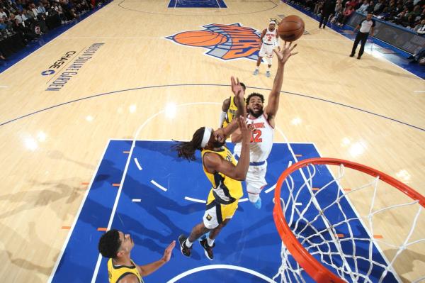 Karl-Anthony Towns #32 of the New York Knicks drives to the basket during the game against the Indiana Pacers
