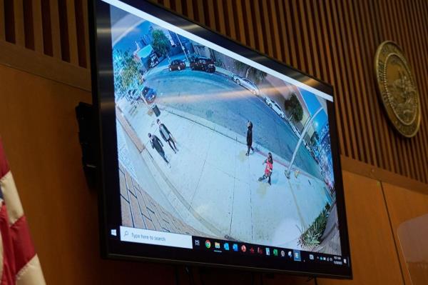 A witness looks at evidence during Rakim Mayers, aka A$AP Rocky, preliminary hearing