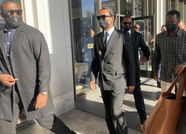 ASAP Rocky leaves court in Los Angeles with his lawyer Joe Tacopina after a judge ruled probable cause exists to charge him with two counts of first-degree assault.