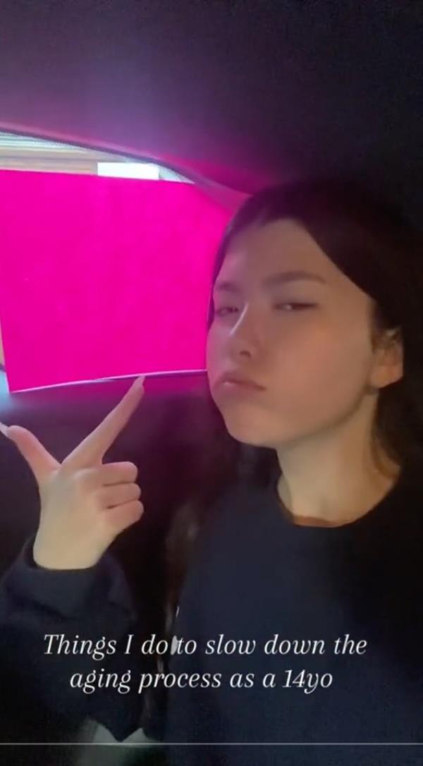 14-year-old TikToker showing anti-aging routine taping paper to window