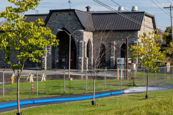Workers at the scene of a water main rupture in Watertown, New York on October 19, 2023.