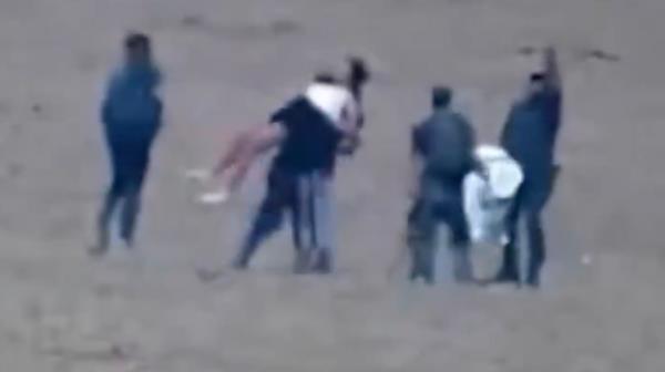 Security camera footage aired Monday, Dec. 4, 2023, by Israel's Channel 12 News shows released hostage Amit Soussana, 40, being kidnapped from her home in Kibbutz Kfar Azza to Gaza by Hamas terrorists