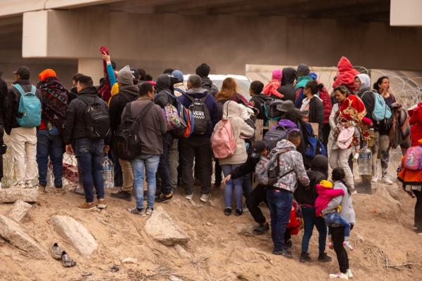 Migrants try to cross into Texas.