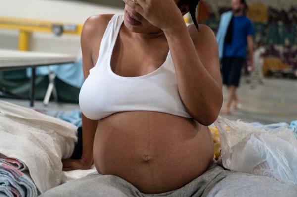 Pregnant migrant at Annunciation House shelter in El Paso, Texas.
