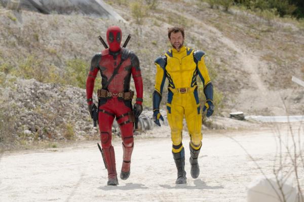 Ryan Reynolds, left, as Deadpool/Wade Wilson and Hugh Jackman, right, as Wolverine/Logan walk in a scene from 