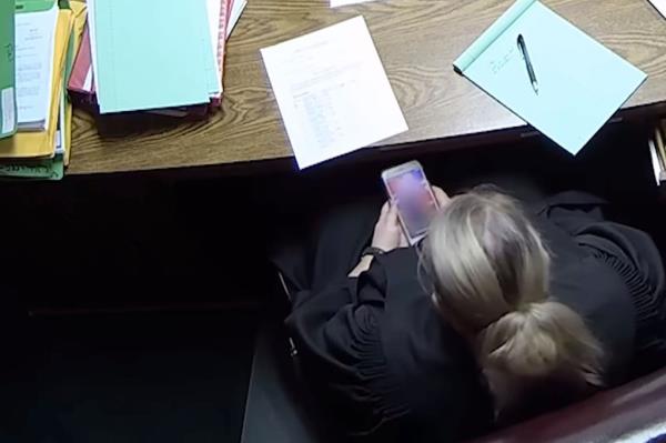 A screengrab of the footage showing Soderstrom on her phone.