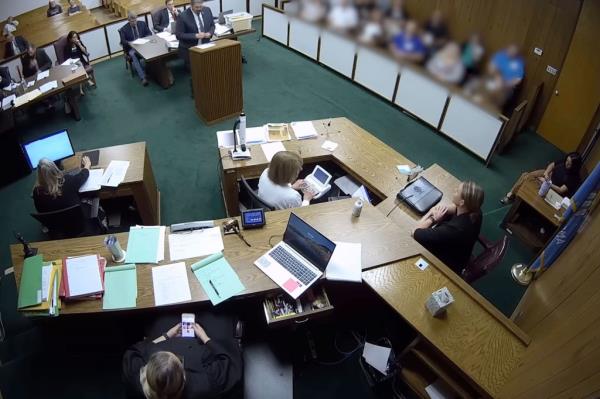 Soderstrom is pictured on her phone during the trial.