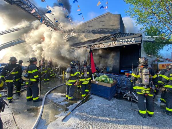 Firefighters respond to fire at Bushwick supermarket. 