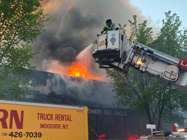 Firefighters respond to fire at Bushwick supermarket. 