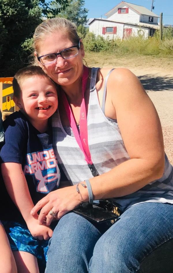 Grayson, 8, with his mother, Renee Unruh. 
