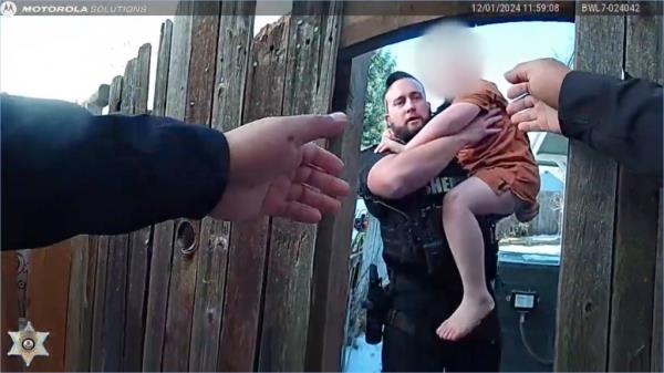 Both children were barefoot and wearing shorts as they were carried to safety in the snow.