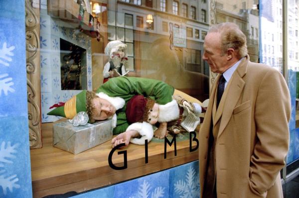 Will Ferrell lying down in a store window while James Caan looks at him. 