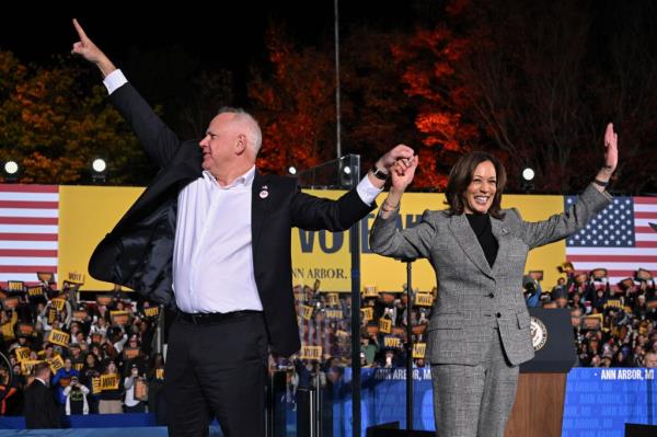 Minnesota Gov. Tim Walz and Harris arrive at a campaign rally in Ann Arbor, Michigan on Oct. 28, 2024.