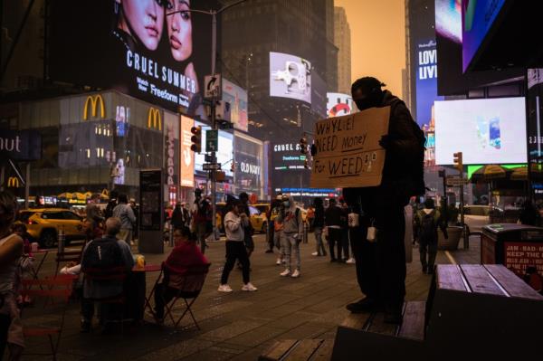 A think layer a smoke is seen in Time Square on June 7, 2023.