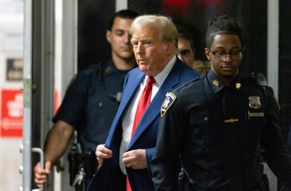 Former President Do<em></em>nald Trump leaves the courtroom for the day during his trial for allegedly covering up hush mo<em></em>ney payments at Manhattan Criminal Court on April 30, 2024 in New York City. 