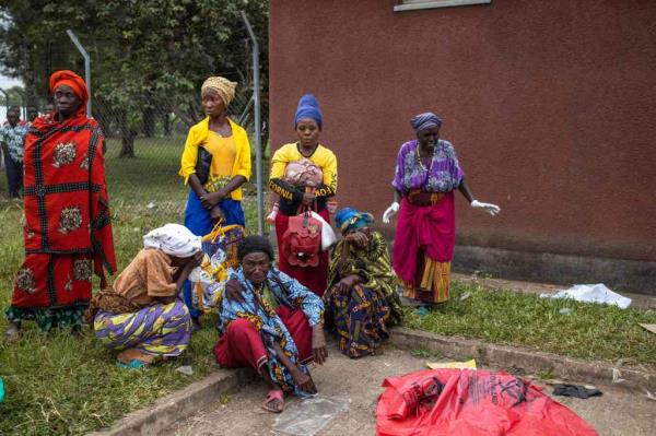 Relatives of victims of the Mpo<em></em>ndwe Lhubiriha Seco<em></em>ndary School gather at the Bwera General Hospital Mortuary, Kasese, on June 18.