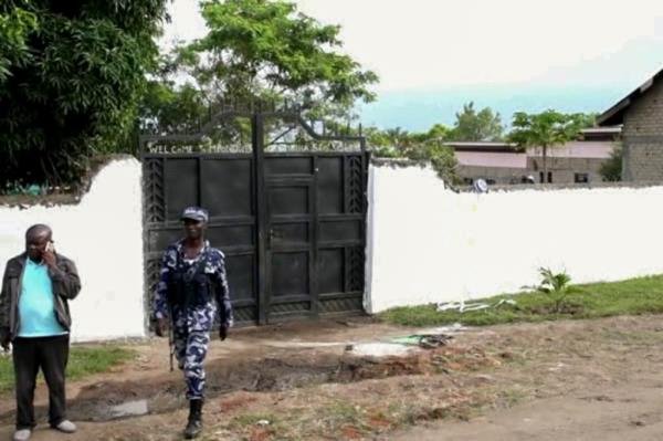 security forces are seen outside the gate of the Lhubiriha Seco<em></em>ndary School following an attack on the school near the border with Congo, in Mpondwe, Uganda, Saturday, June 17, 2023