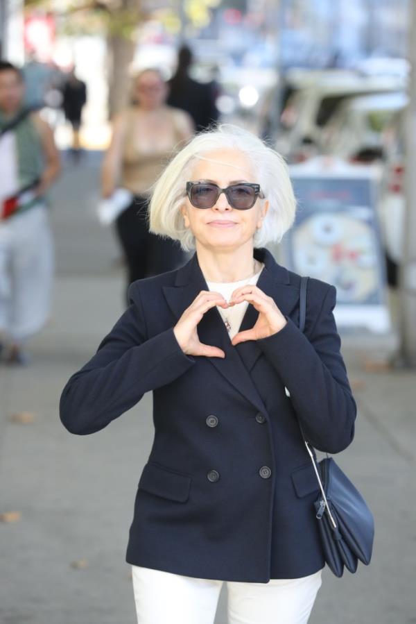 Mahnaz Momeni making a heart gesture at her son's murder tria.