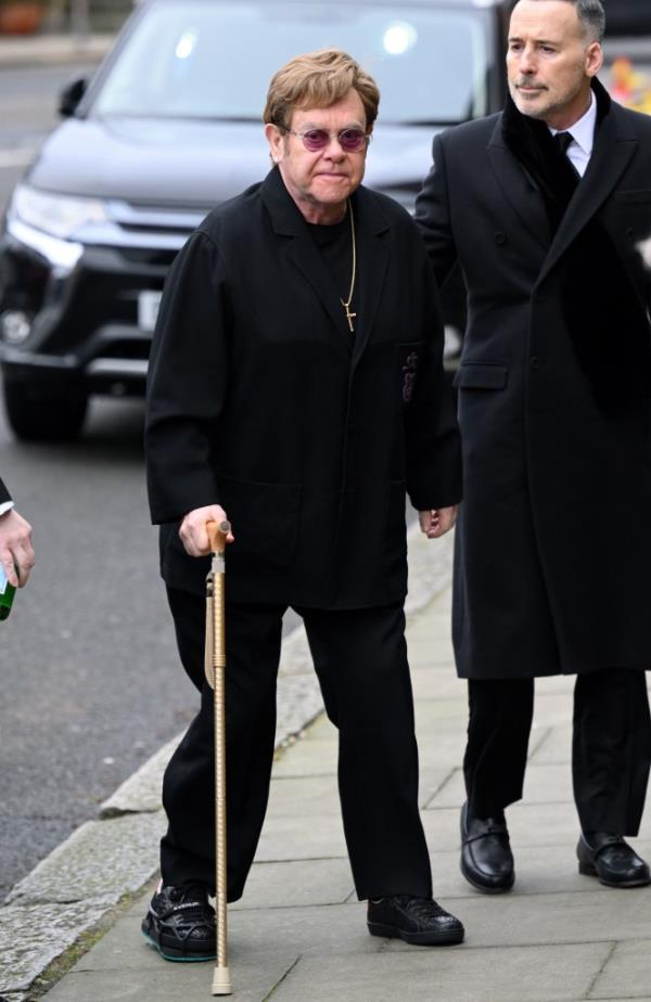 Elton John walking with a cane in Feb. 2024.