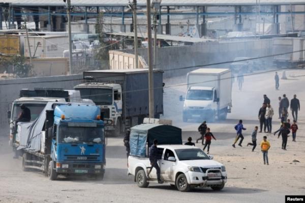FILE - Trucks carrying aid arrive, amid the o<em></em>ngoing co<em></em>nflict between Israel and the Palestinian Islamist group Hamas, in Rafah in the southern Gaza Strip, Jan. 17, 2024.