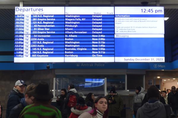 A sign at Penn Station on Dec. 31 with all of the trains experiencing delays.