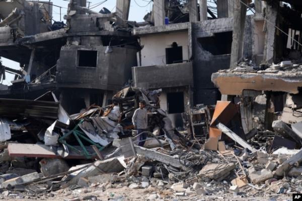 A Palestinian looks at the destruction left by an Israeli bombardment in the Maghazi refugee camp, central Gaza Strip, on Feb. 16, 2024.