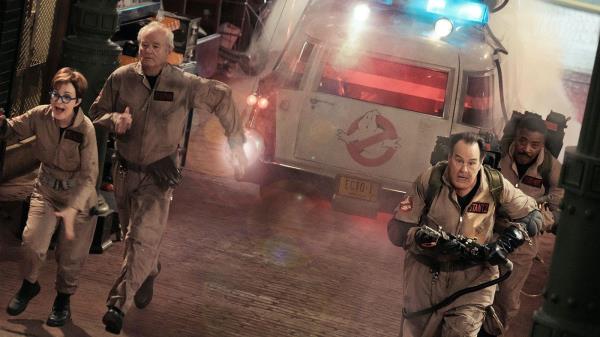 Annie Potts Bill Murray Dan Aykroyd and Ernie Hudson running from Ecto-1 in Ghostbusters Frozen Empire