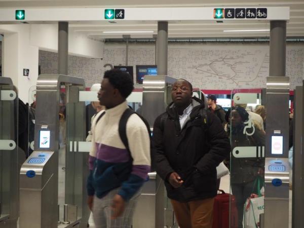 Commuters at one of Paris' busiest transit and railroad hubs, Gare du Nord, pass through one of the models of fare gates the MTA has publicly demonstrated