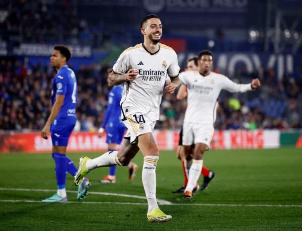 Joselu double sends Madrid top at Getafe