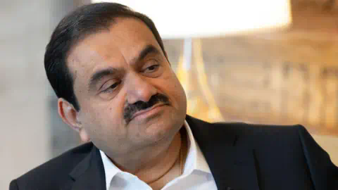 Getty Images Gautam Adani, chairman of Adani Group, during a Bloomberg Television interview at the company's headquarters in Ahmedabad, Gujarat, India, on Saturday, May 25, 2024. Gautam Adani says he'll shift co<em></em>ntrol to his scions in the early 2030s.